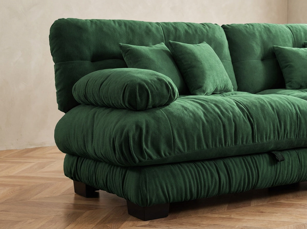 Close-up of the Cloudies tufted seat, rounded arm and black block feet in Emerald Green