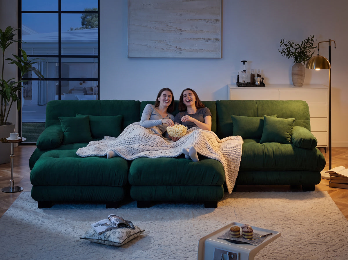 Friends stretched out on a Cloudies sofa with the ottomans pushed in for movie night